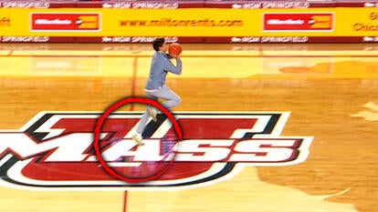 Student Noah Lee shoots a half-court shot