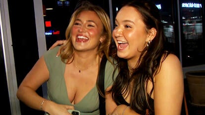 Two women out in a blizzard without a jacket