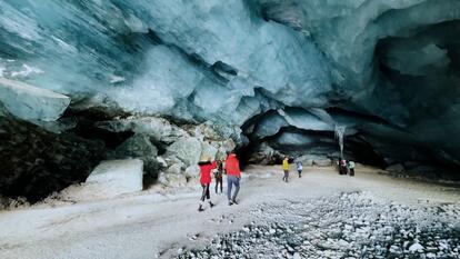 Entrance to naturally made ice cave inside a Swiss glacier