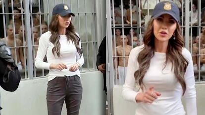 Kristi Noem standing in front of prison cell in El Salvador