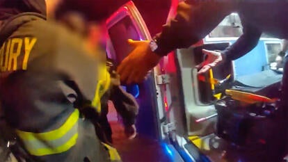 Firefighters carry man allegedly held captive into ambulance