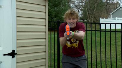 Teen with water gun