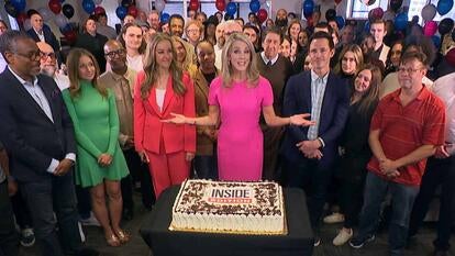 Deborah Norville surrounded by people who work with her on camera and behind the scenes at Inside Edition