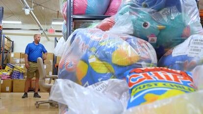 Man standing in full warehouse