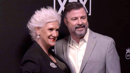 Anne Burrell and her husband on a red carpet