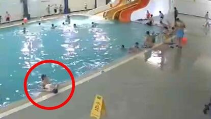 Man saving child from drowning in pool