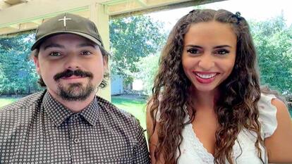 Couple smiling together looking into camera