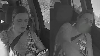 Woman texting while driving, trying to control the steering wheel