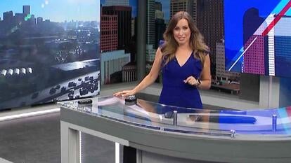  Meteorologist giving weather report at news desk