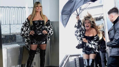 Heidi Klum posing outside with an umbrella during a Noreaster in New York