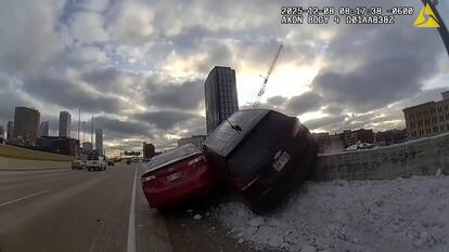 Car Hanging Over Retaining Wall After Accident 