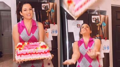 Woman holding a cake / Woman bracing to catch a cake 