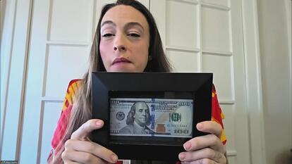 Robyn Gentry with framed $100