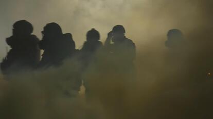 People wearing gas masks