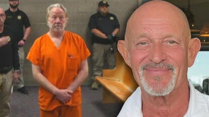 Timothy Busfield standing in an orange jumpsuit in a courtroom / Colin Swift