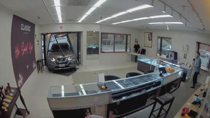 Security footage of an SUV crashing through the front of a jewelry store