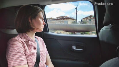 Amanda Knox looking out a car window driving through Italy