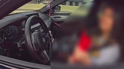 Woman in driver's seat of car