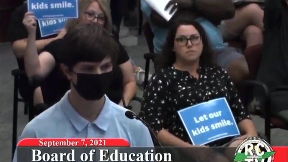 A young student in Tennessee was laughed at during a school board meeting when he revealed that his grandmother, a former teacher, died from COVID-19.