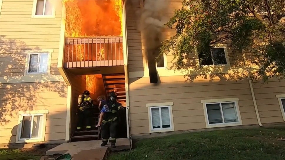 Firefighters Brave Flaming Building to Save Residents 