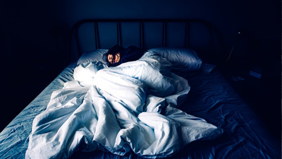 A stock image of a woman sleeping.