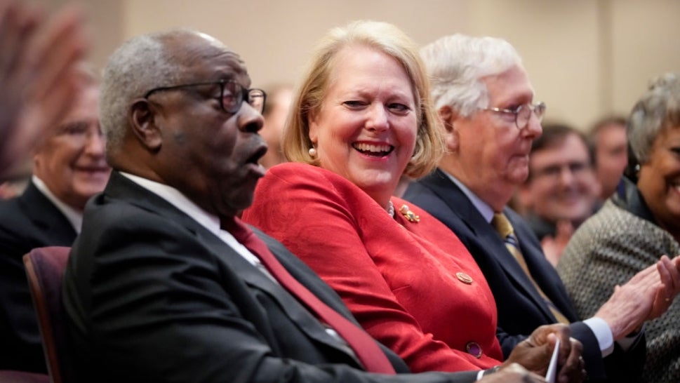 Supreme Court Justice Clarence Thomas, left, appears in a photograph with his wife, Ginni Thomas, right.