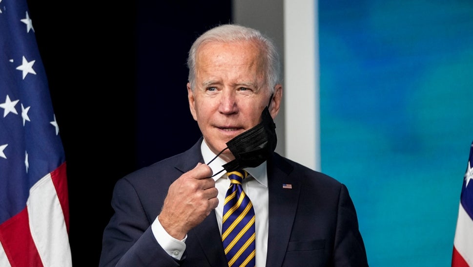 Joe Biden taking his mask off his face