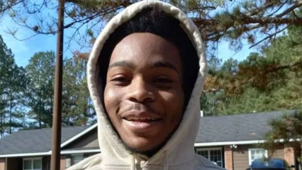 MiQuavious Blanchard, Black teen boy smiling wearing tan hoodie