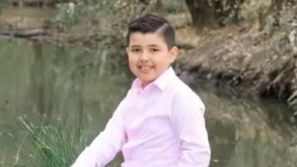 Anthony Duran, 10-years-old, smiling and wearing pink button up