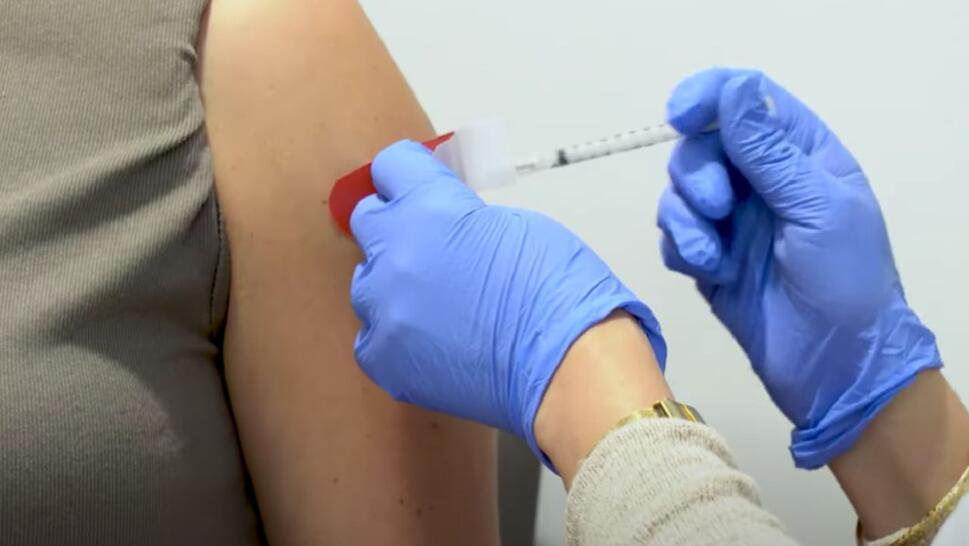 doctor giving shot into someone's arm