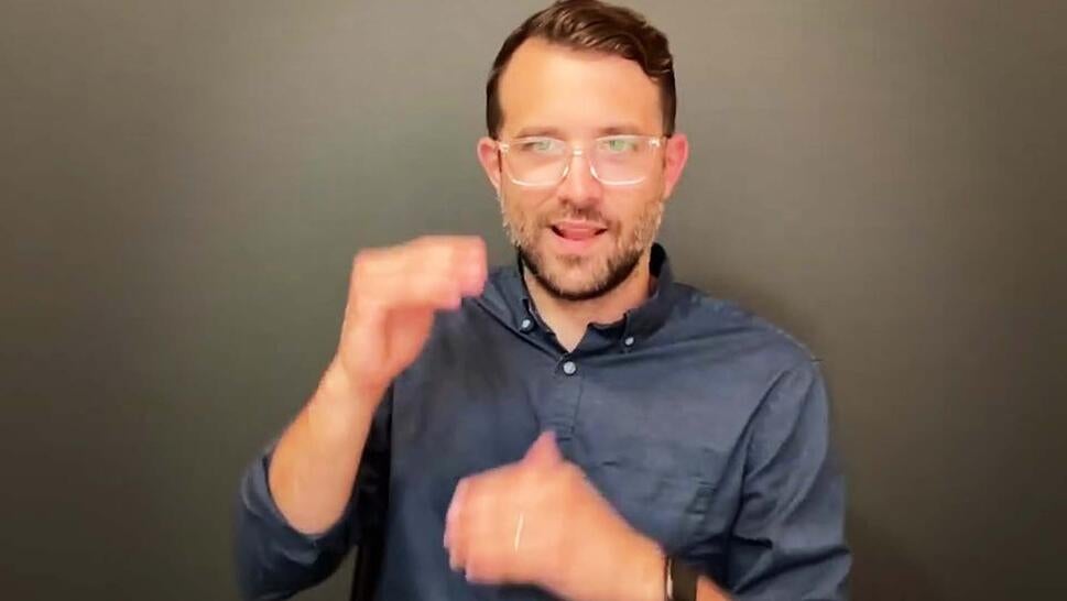 American Sign Language interpreter Joshua Seal.