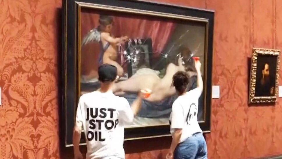 Activist smash protective glass on famous painting.
