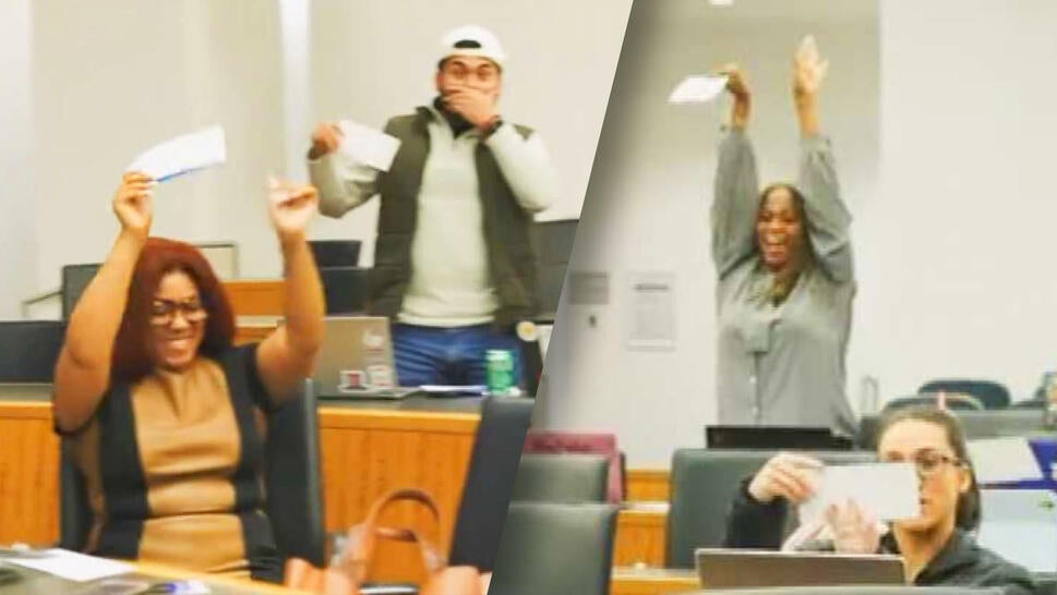 Georgia State Law students cheer after Professor Mo Ivory tells them they are going to the Paris 2024 Olympics.