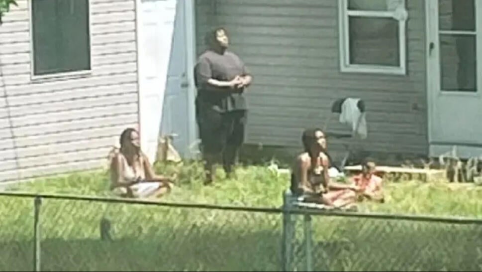 Some of the missing meditating outside the rental home before their disappearance.