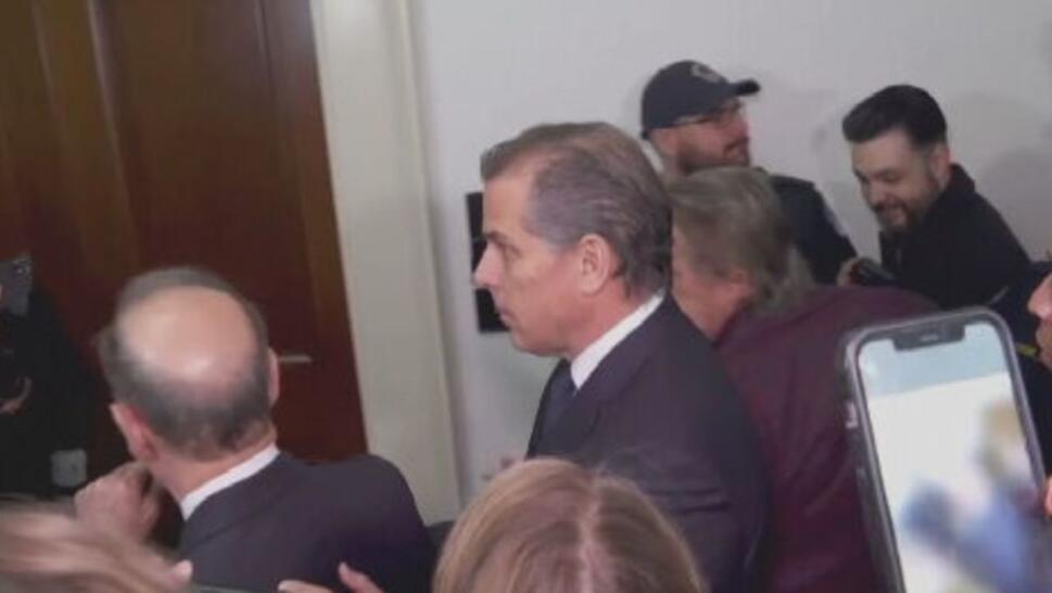 Hunter Biden surrounded by reporters