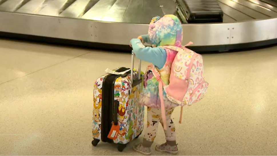 Child with suitcase