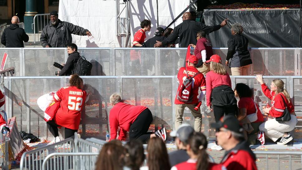 People take cover during a shooting at Union Station during the Kansas City Chiefs Super Bowl LVIII victory parade on February 14, 2024 in Kansas City, Missouri