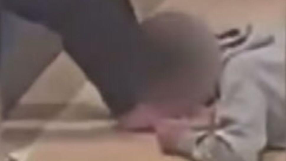 student licking another person's feet