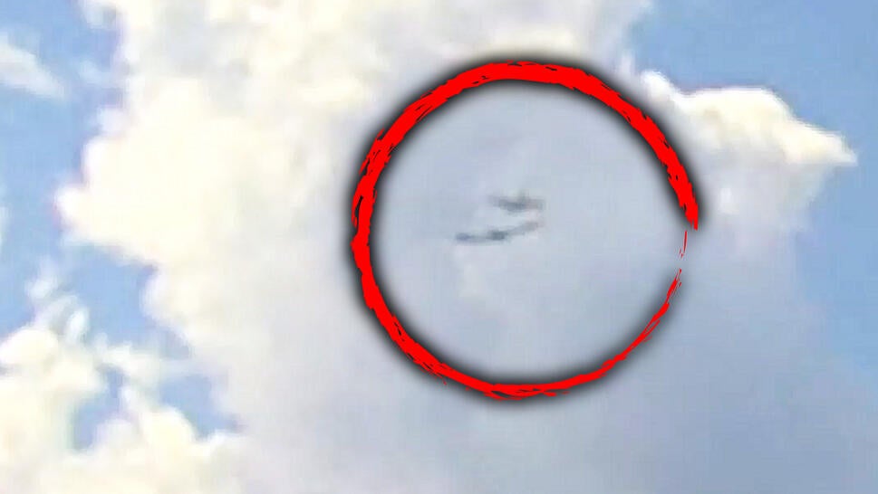 Two airplanes almost collide in the air.