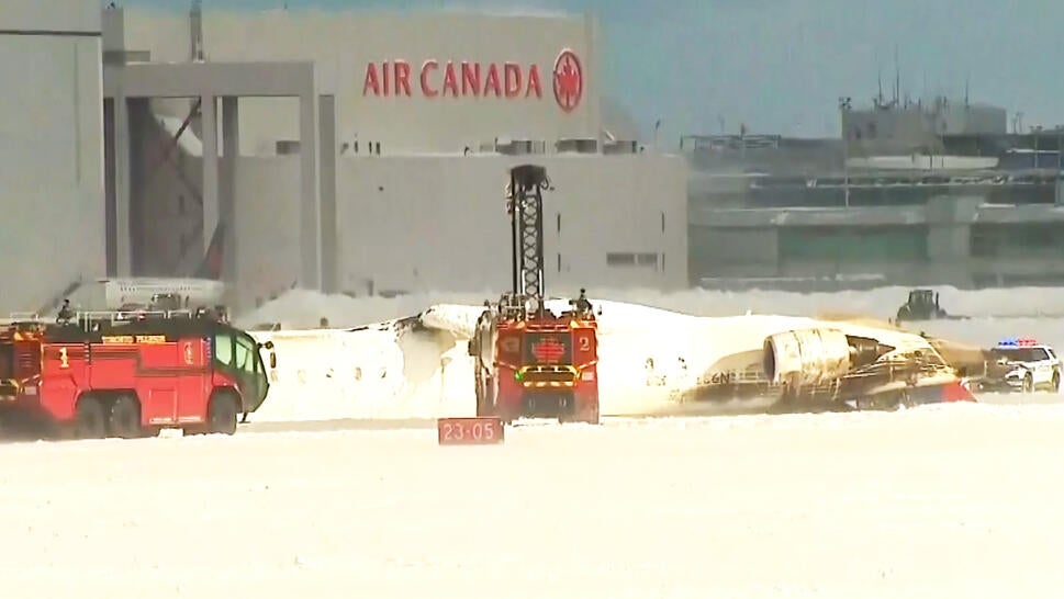 Emergency vehicles respond to upside down plane at airport in Canada