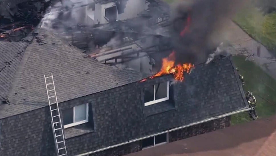 Apartment building on fire from above