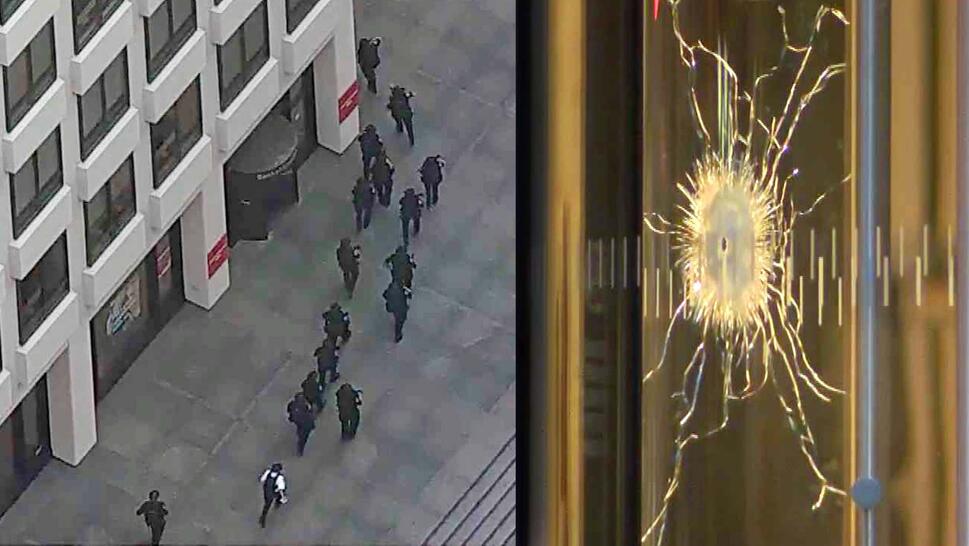 Bird's eye view of a line of police officers tactically entering an office building / Close up of a bullet hole in glass