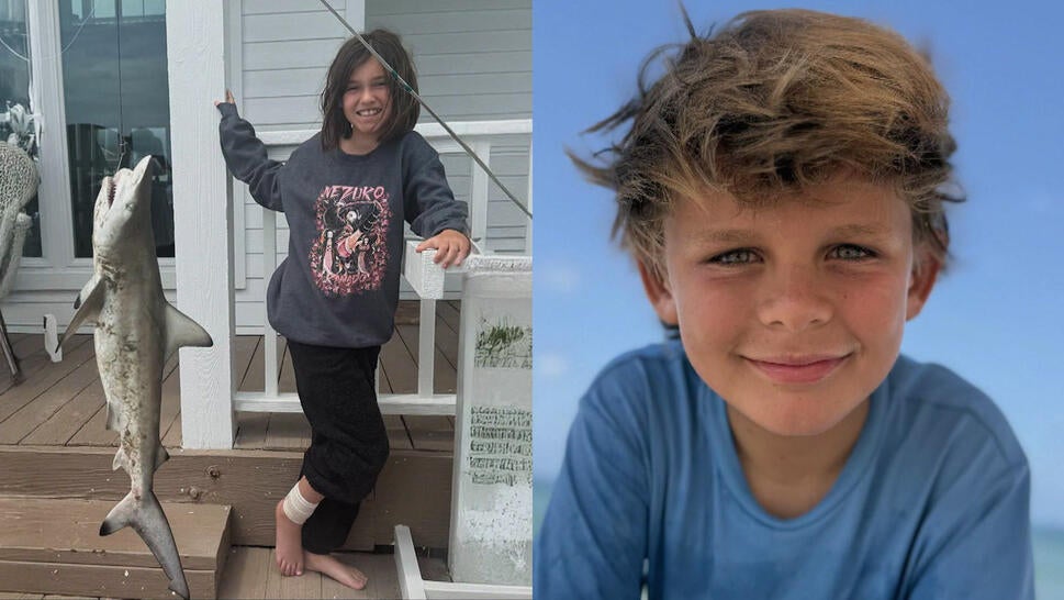 Harper Ochoa holding up a caught shark, Richard Burroughs