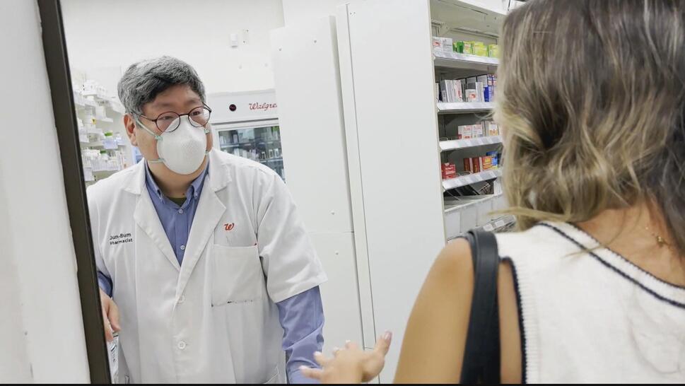 Customer talking to pharmacist