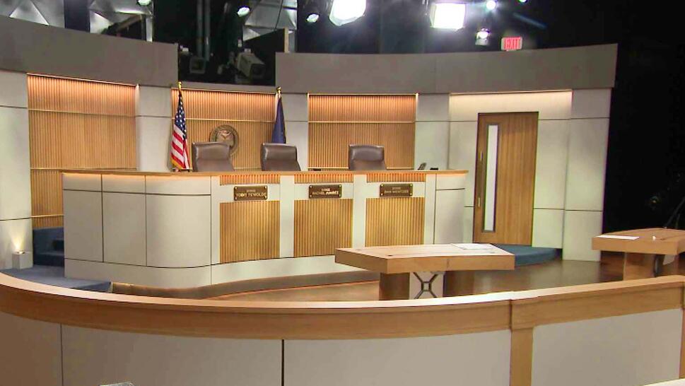 Three judge benches placed on a television set