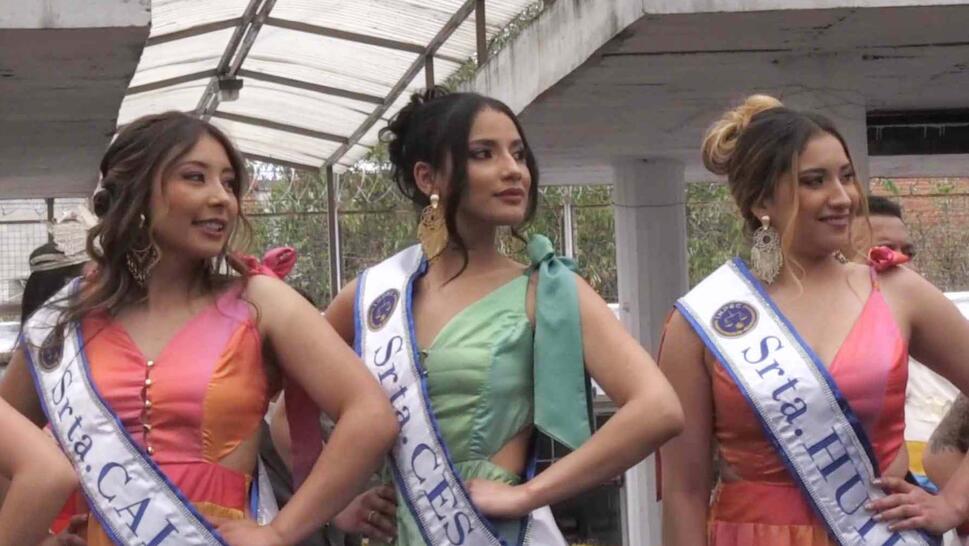Pageant contestants wearing sashes