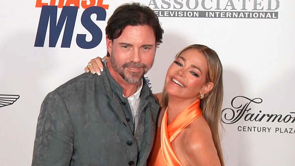 Denise Richards and her ex, Aaron Phypers, on a red carpet