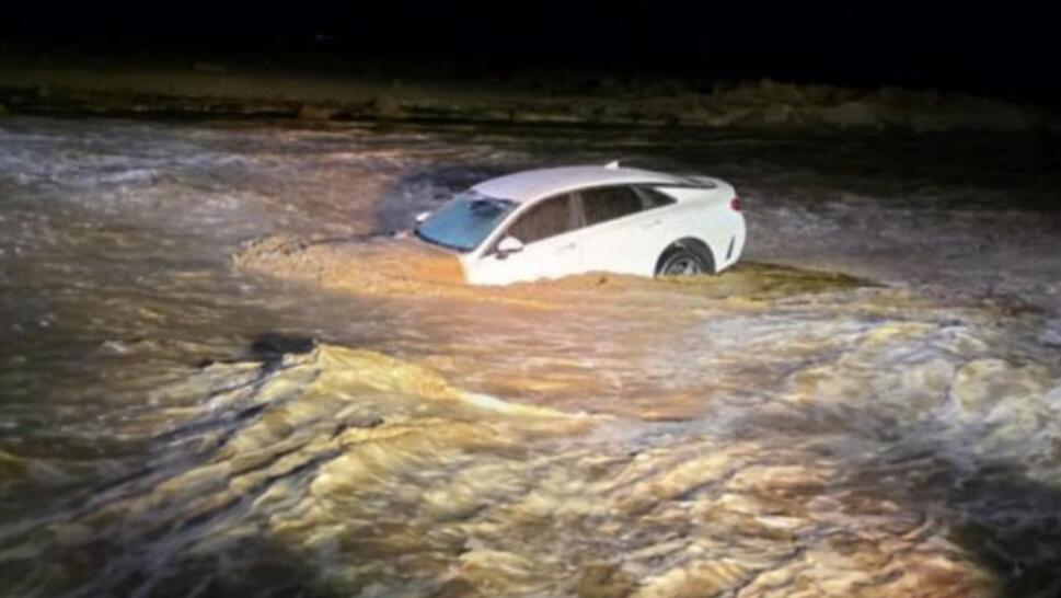 vehicle after being swept away in flood waters