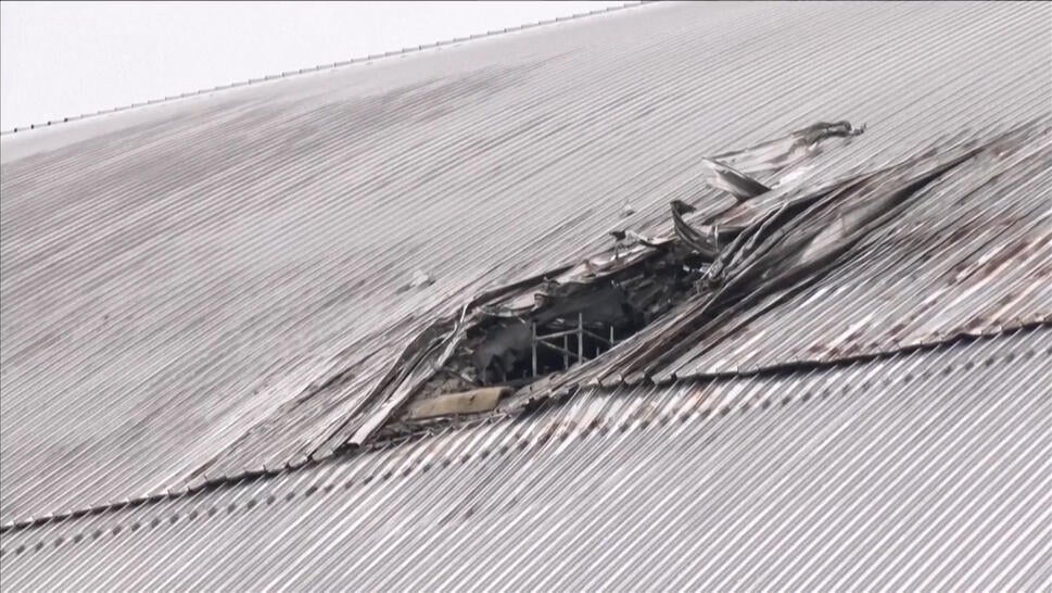 Jagged hole in roof of Chernobyl containment structure