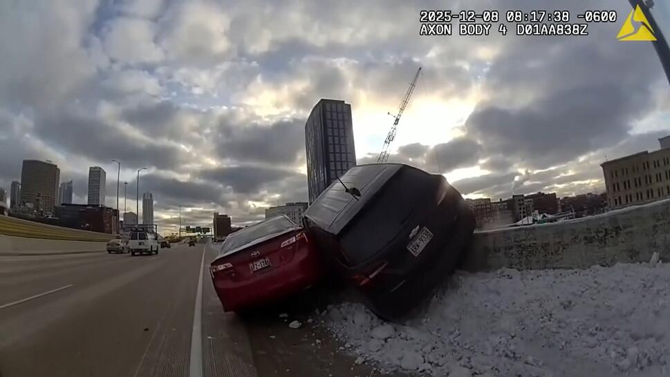 Car Hanging Over Retaining Wall After Accident 
